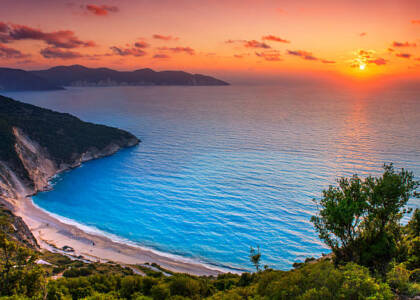 Beautiful summer sunset on Mirtos beach in Greece